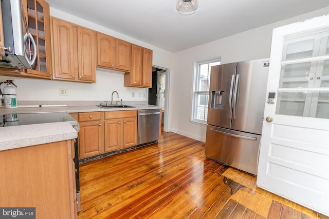 28 Bowen Ave, Woodstown, NJ 08098 - kitchen with stainless steel appliances, a sink, light countertops, and hardwood / wood-style floors