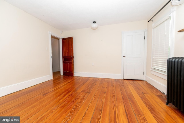 28 Bowen Ave, Woodstown, NJ 08098 - empty room featuring radiator heating unit, light wood-type flooring, and baseboards