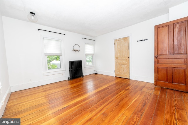 28 Bowen Ave, Woodstown, NJ 08098 - unfurnished living room with radiator, hardwood / wood-style floors, and baseboards