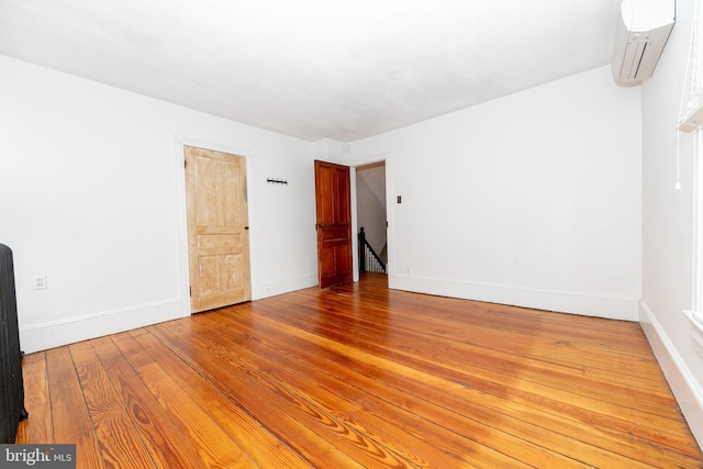 28 Bowen Ave, Woodstown, NJ 08098 - spare room featuring a wall mounted AC, light wood-style floors, and baseboards