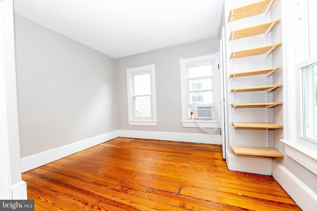 28 Bowen Ave, Woodstown, NJ 08098 - spare room featuring wood-type flooring, baseboards, and cooling unit