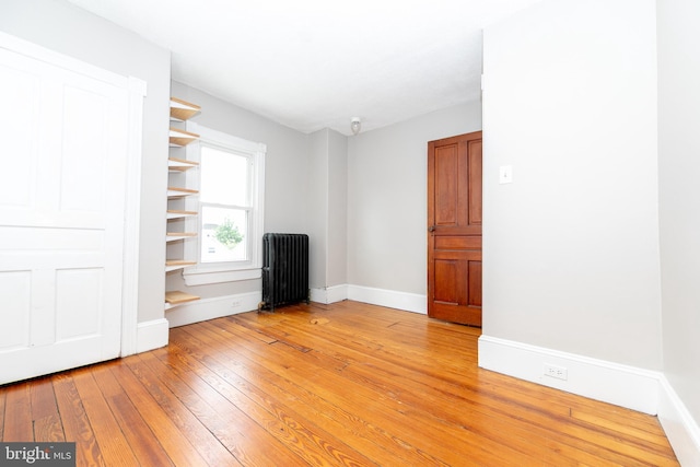 28 Bowen Ave, Woodstown, NJ 08098 - empty room featuring radiator, light wood-style floors, and baseboards