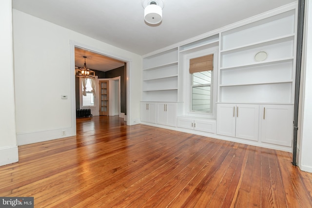 28 Bowen Ave, Woodstown, NJ 08098 - unfurnished room featuring built in shelves, light wood-style flooring, and baseboards