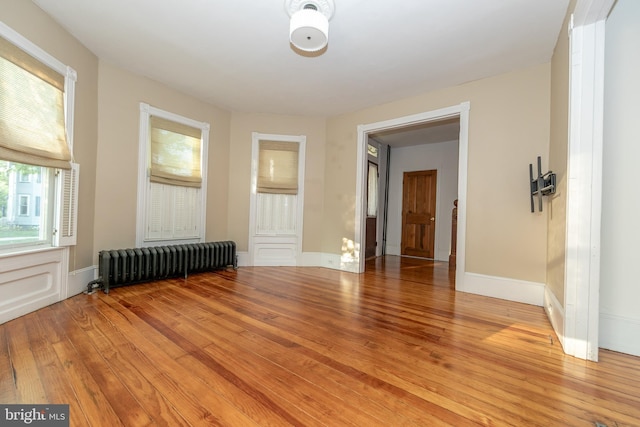 28 Bowen Ave, Woodstown, NJ 08098 - empty room with radiator heating unit, light wood-type flooring, and baseboards