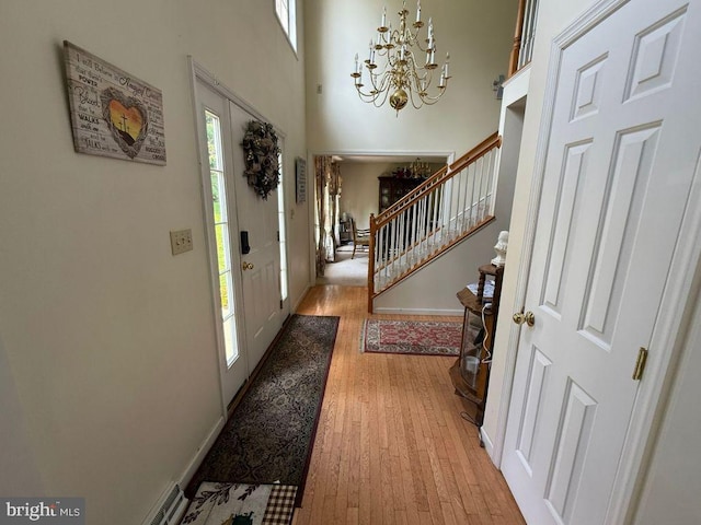 530 Glenhaven Dr, Glenshaw, PA 15116 - entrance foyer featuring stairs, a chandelier, light wood-type flooring, and a high ceiling