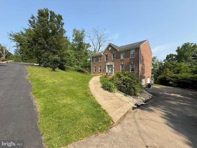 530 Glenhaven Dr, Glenshaw, PA 15116 - colonial home with brick siding, a front lawn, and asphalt driveway