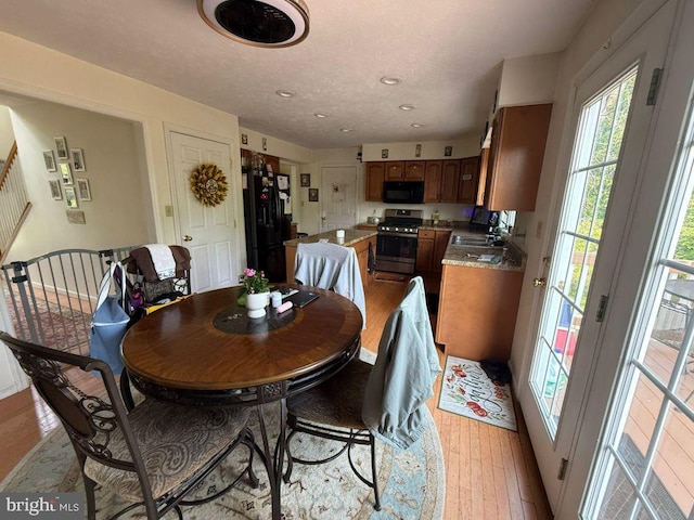 530 Glenhaven Dr, Glenshaw, PA 15116 - dining space with light wood-style floors, stairway, and recessed lighting