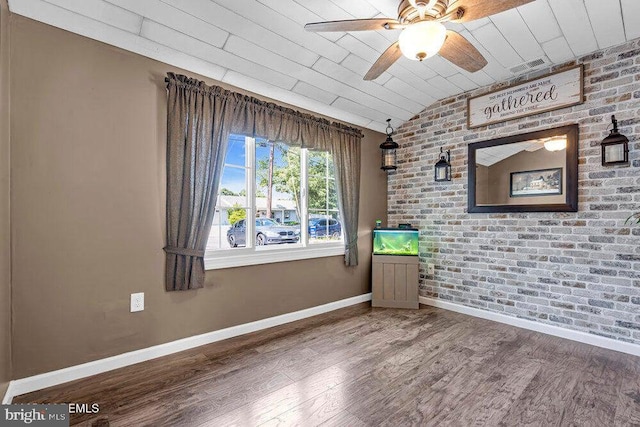 111 Lawrence Dr, Lanoka Harbor, NJ 08734 - unfurnished room featuring wood finished floors, ceiling fan, baseboards, brick wall, and lofted ceiling
