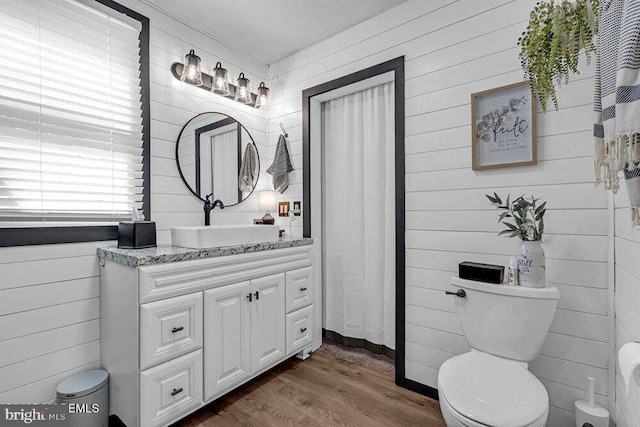 111 Lawrence Dr, Lanoka Harbor, NJ 08734 - full bathroom with vanity, wood finished floors, toilet, and wood walls
