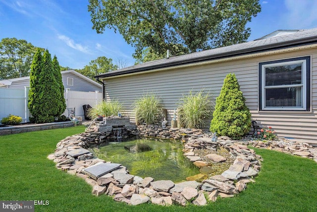 111 Lawrence Dr, Lanoka Harbor, NJ 08734 - view of yard featuring a garden pond