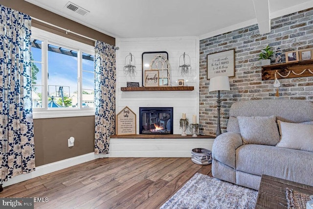 111 Lawrence Dr, Lanoka Harbor, NJ 08734 - living area with wood finished floors, a large fireplace, and baseboards