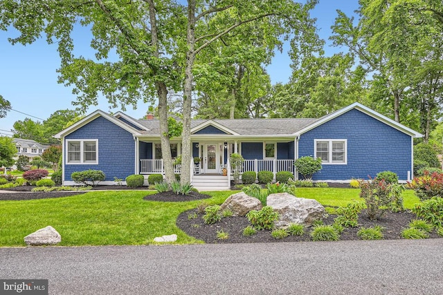 3528 Cohasset Ave, Annapolis, MD 21403 - ranch-style house featuring a porch, a front yard, and a chimney
