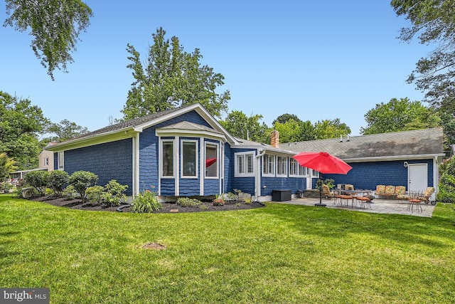 3528 Cohasset Ave, Annapolis, MD 21403 - view of front of home with a patio, a front yard, and a chimney