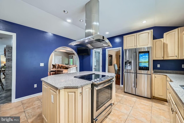 3528 Cohasset Ave, Annapolis, MD 21403 - kitchen featuring appliances with stainless steel finishes, island range hood, arched walkways, light stone counters, and light brown cabinetry