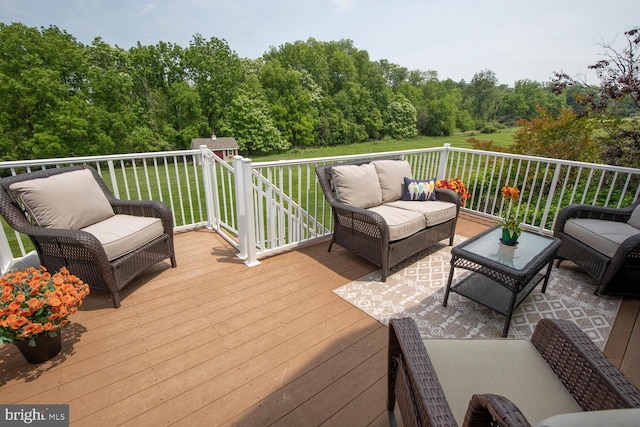 228 Chandler Way, Perkasie, PA 18944 - deck featuring outdoor lounge area, a yard, an outdoor structure, and a view of trees