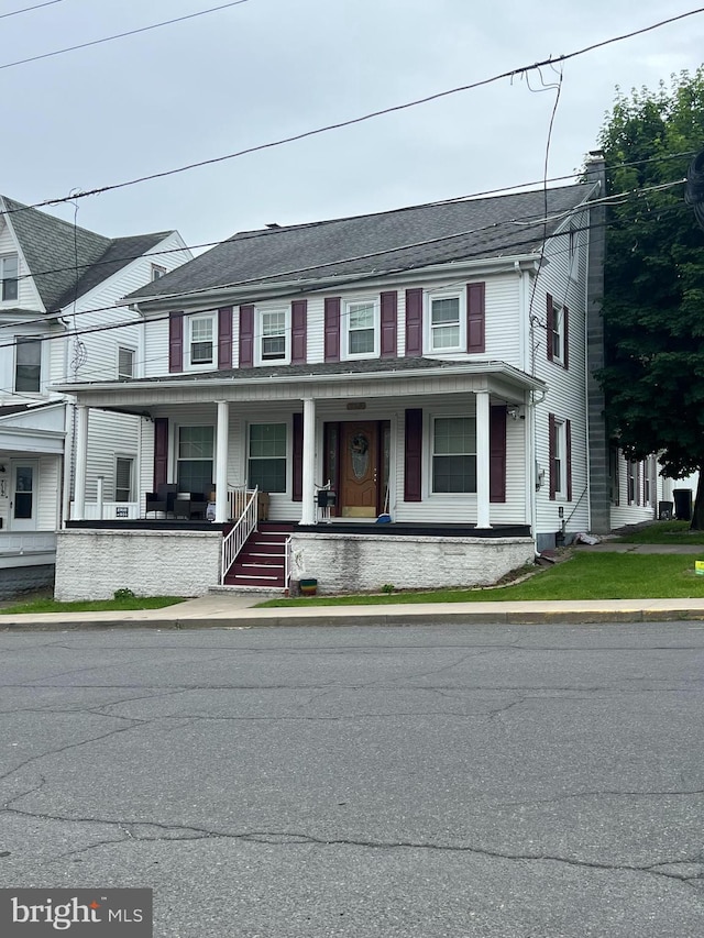 718 W Pine St, Shamokin, PA 17872 - townhome / multi-family property with a porch and a chimney