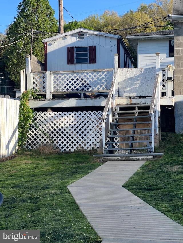 718 W Pine St, Shamokin, PA 17872 - back of house with stairway, a lawn, and a deck