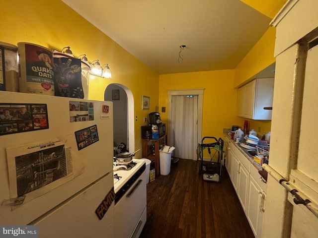 818 Rte 481, Monongahela, PA 15063 - kitchen featuring arched walkways, white cabinetry, dark wood-style floors, light countertops, and freestanding refrigerator