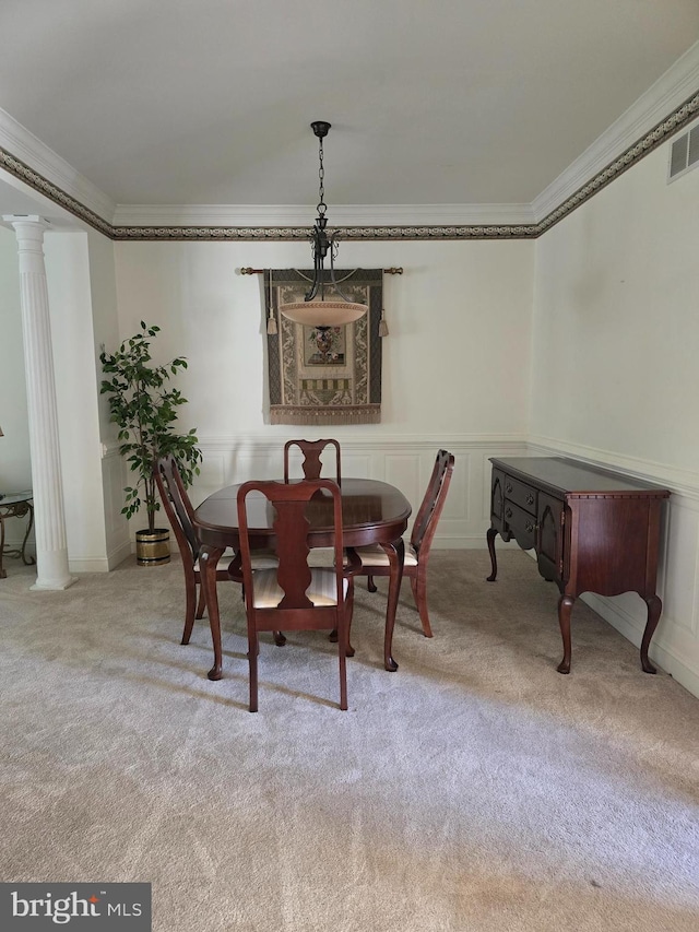 721 Kincaid Mills Ln, Wallingford, PA 19086 - carpeted dining space with crown molding, decorative columns, and wainscoting