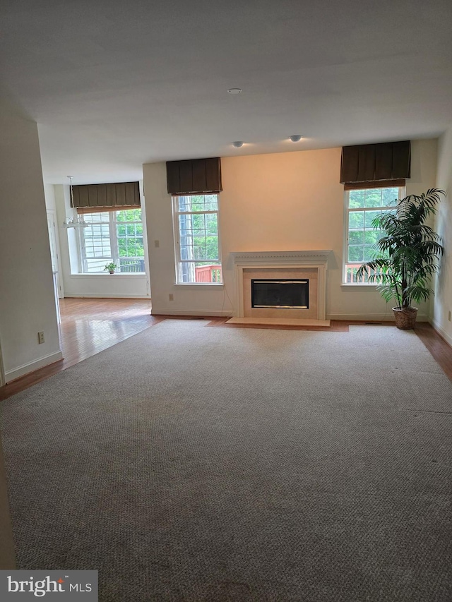 721 Kincaid Mills Ln, Wallingford, PA 19086 - unfurnished living room with a glass covered fireplace and wood finished floors