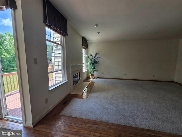 721 Kincaid Mills Ln, Wallingford, PA 19086 - unfurnished living room with a premium fireplace and wood-type flooring