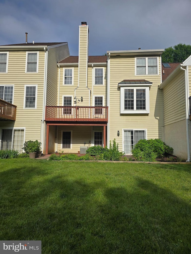721 Kincaid Mills Ln, Wallingford, PA 19086 - rear view of house with a chimney, a yard, and a deck