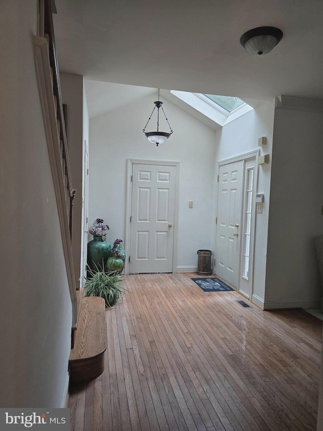 721 Kincaid Mills Ln, Wallingford, PA 19086 - foyer entrance with a skylight, wood-type flooring, and lofted ceiling