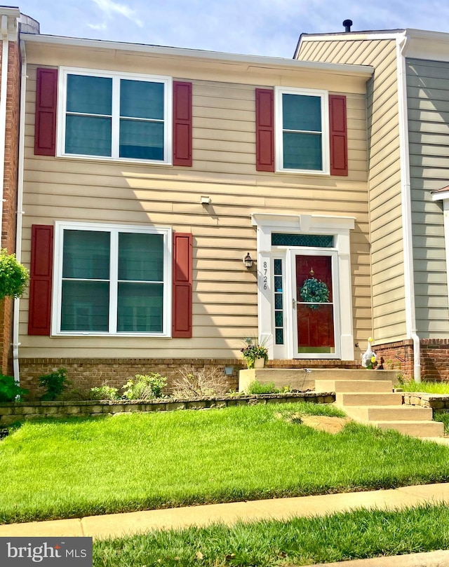 8726 Wadebrook Ter, Springfield, VA 22153 - view of front of home featuring brick siding and a front yard
