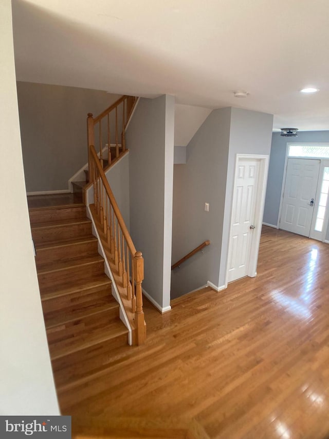 8726 Wadebrook Ter, Springfield, VA 22153 - stairway featuring wood finished floors, baseboards, and recessed lighting