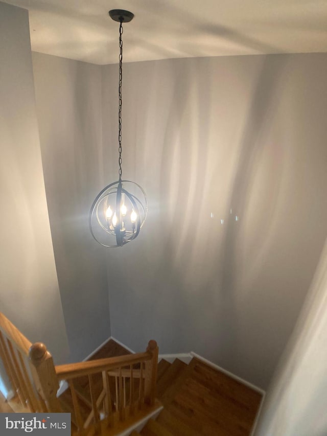 8726 Wadebrook Ter, Springfield, VA 22153 - staircase with a chandelier and wood finished floors
