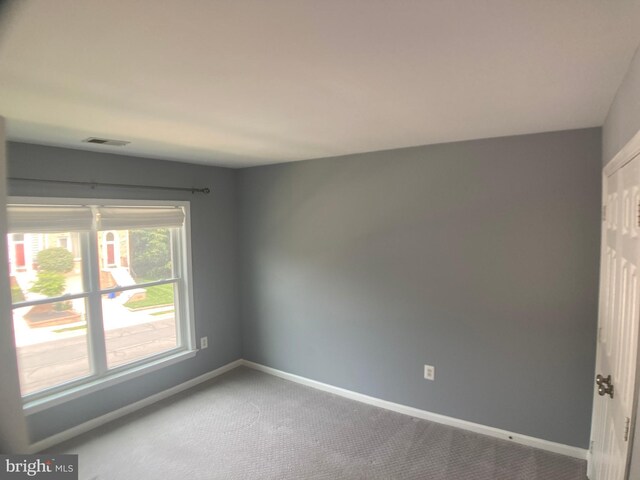 8726 Wadebrook Ter, Springfield, VA 22153 - carpeted spare room featuring baseboards