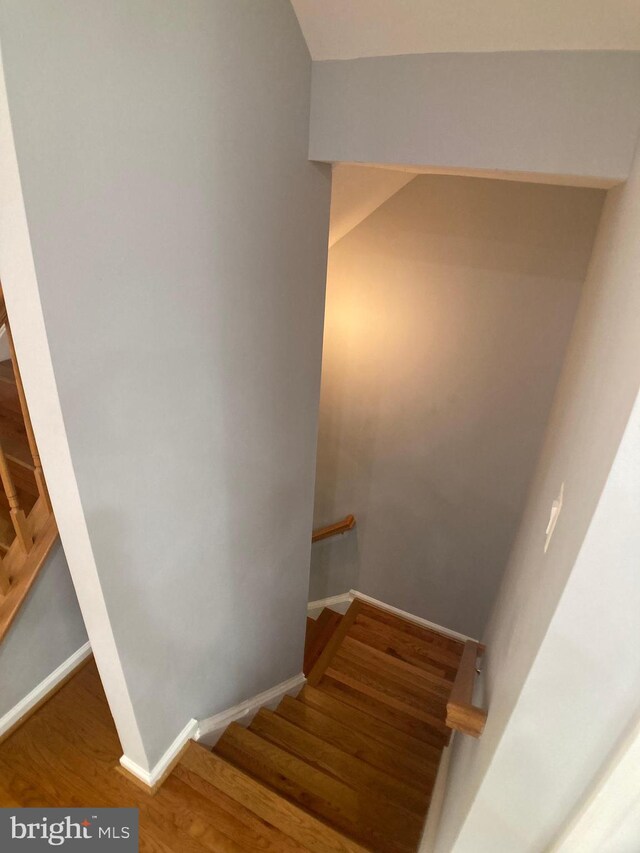 8726 Wadebrook Ter, Springfield, VA 22153 - staircase featuring wood finished floors and baseboards