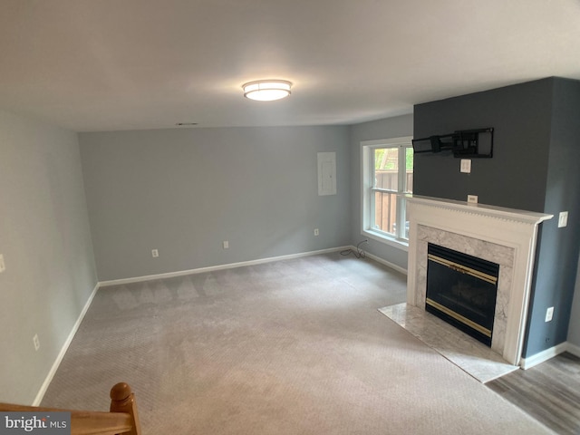 8726 Wadebrook Ter, Springfield, VA 22153 - unfurnished living room with a fireplace, baseboards, and carpet flooring