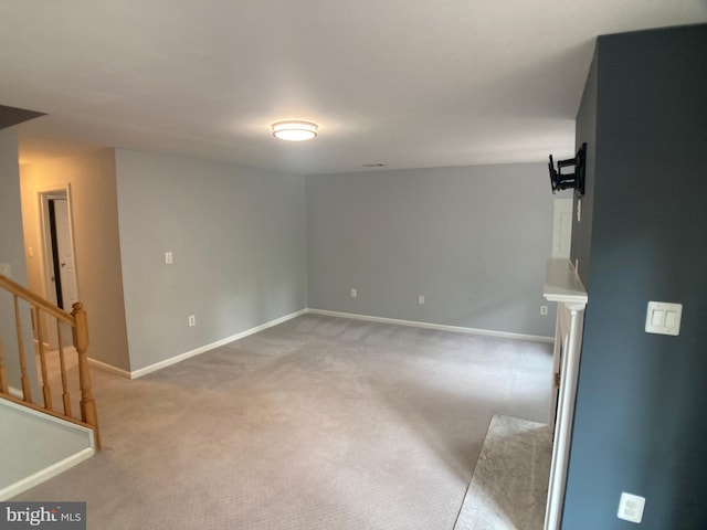 8726 Wadebrook Ter, Springfield, VA 22153 - empty room with light carpet, baseboards, and stairs