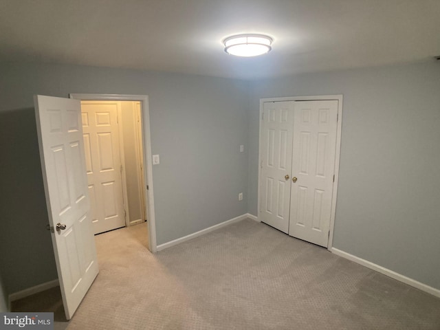 8726 Wadebrook Ter, Springfield, VA 22153 - unfurnished bedroom with light colored carpet, baseboards, and a closet