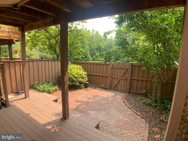 8726 Wadebrook Ter, Springfield, VA 22153 - wooden terrace featuring a gate and a patio area