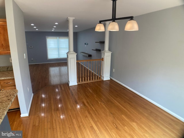 8726 Wadebrook Ter, Springfield, VA 22153 - empty room featuring ornate columns, hardwood / wood-style flooring, baseboards, and recessed lighting