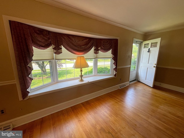 604 Ivystone Ln, Cinnaminson, NJ 08077 - entryway with baseboards, plenty of natural light, light wood-style floors, and ornamental molding