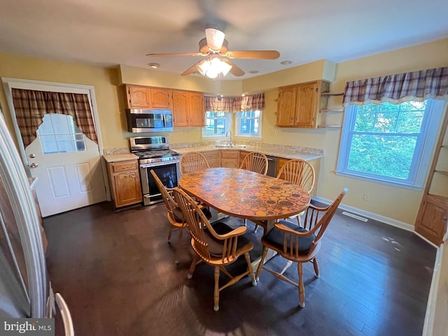 604 Ivystone Ln, Cinnaminson, NJ 08077 - dining space with dark wood-style floors, ceiling fan, and baseboards