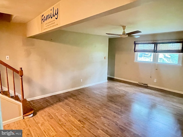 604 Ivystone Ln, Cinnaminson, NJ 08077 - empty room with wood finished floors, baseboards, ceiling fan, and stairs