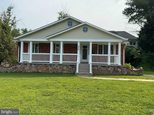 6305 Hawaii Ct, Alexandria, VA 22312 - view of front facade with brick siding, a porch, and a front lawn
