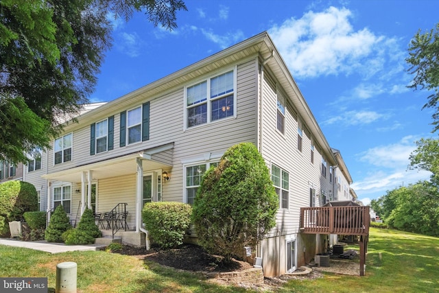 2009 Creekside Ct Unit 28, Warrington, PA 18976 - townhome / multi-family property with covered porch, a front lawn, and central air condition unit