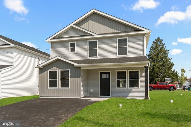 411 New York Ave, Croydon, PA 19021 - view of front of house with a front lawn, a shingled roof, and board and batten siding