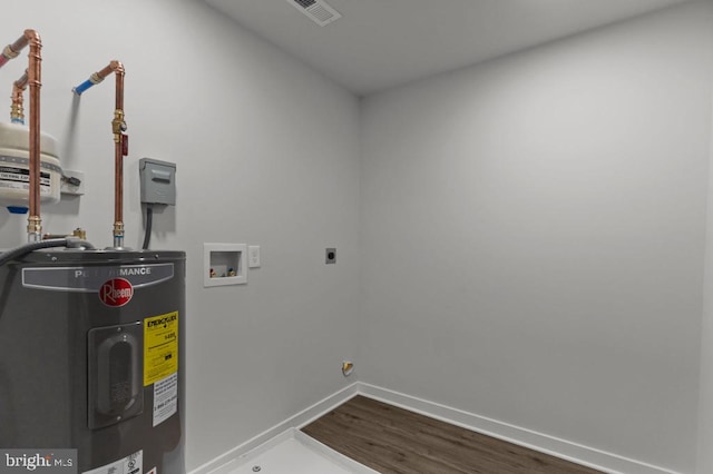 411 New York Ave, Croydon, PA 19021 - laundry area with water heater, hookup for an electric dryer, washer hookup, dark wood-style floors, and baseboards