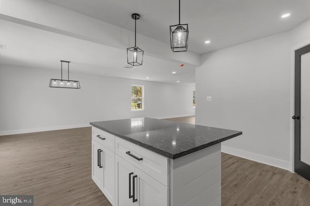411 New York Ave, Croydon, PA 19021 - kitchen with dark wood finished floors, white cabinets, open floor plan, baseboards, and a kitchen island