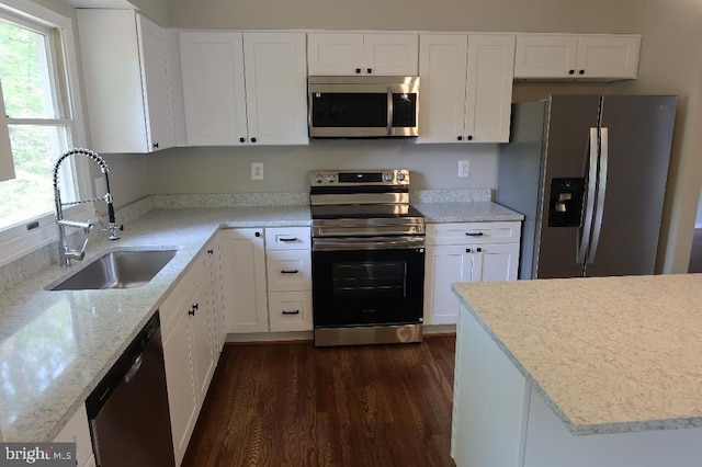 21605 Columbia St, Lexington Park, MD 20653 - kitchen with appliances with stainless steel finishes, a sink, dark wood-type flooring, and white cabinetry