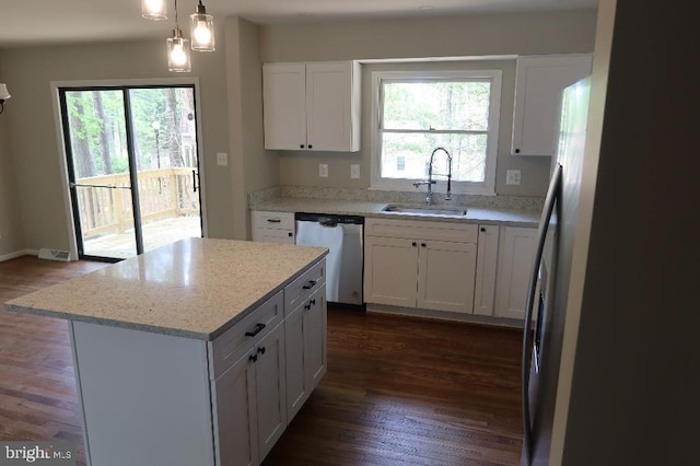 21605 Columbia St, Lexington Park, MD 20653 - kitchen featuring stainless steel dishwasher, a sink, dark wood finished floors, white cabinetry, and a center island