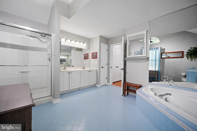 470 N Nautilus Dr, Manahawkin, NJ 08050 - full bathroom featuring vanity, a stall shower, a garden tub, and tile patterned flooring