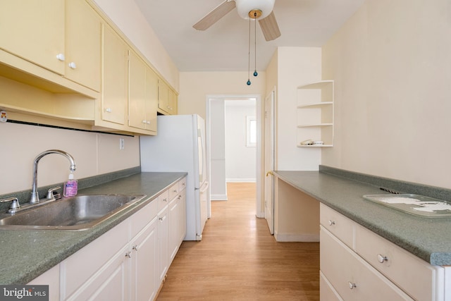 2000 Longview Ct, Baltimore, MD 21237 - kitchen featuring open shelves, freestanding refrigerator, light wood-style floors, a ceiling fan, and dark countertops