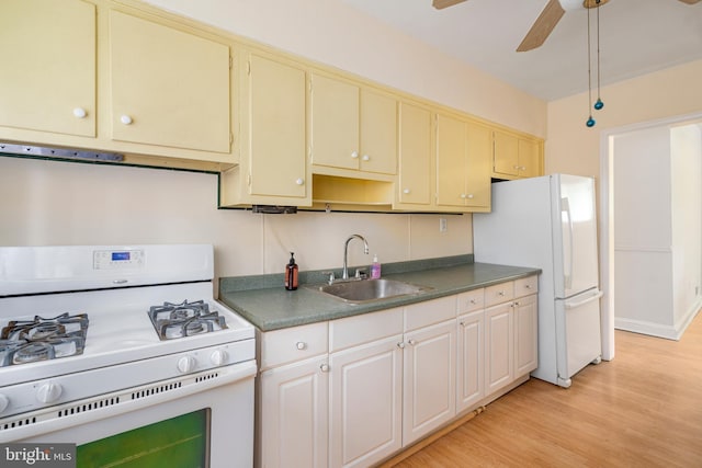 2000 Longview Ct, Baltimore, MD 21237 - kitchen featuring white appliances, ventilation hood, a ceiling fan, light wood-style flooring, and dark countertops